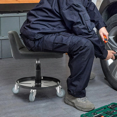 Small rolling stool with HOLKIE 3" grip ring stem caster wheel in a workshop.