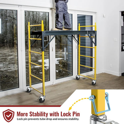 Indoor work scene: worker on mobile scaffolding fitted with HOLKIE 5‑inch dual‑brake scaffold caster wheels, 1‑1/4" square stem, featuring stability lock pin