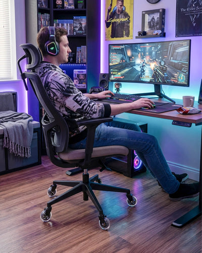 Gaming room scene, man playing game on gaming chair fitted with HOLKIE 3 inch office chair clear casters