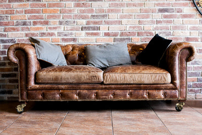 Sofa equipped with HOLKIE antique brass ball casters with side brake